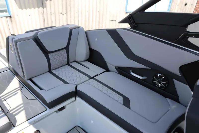 Slide: The Image of 2024 Yamaha Boats 255XE interior with sleek gray seating and modern design. - 27