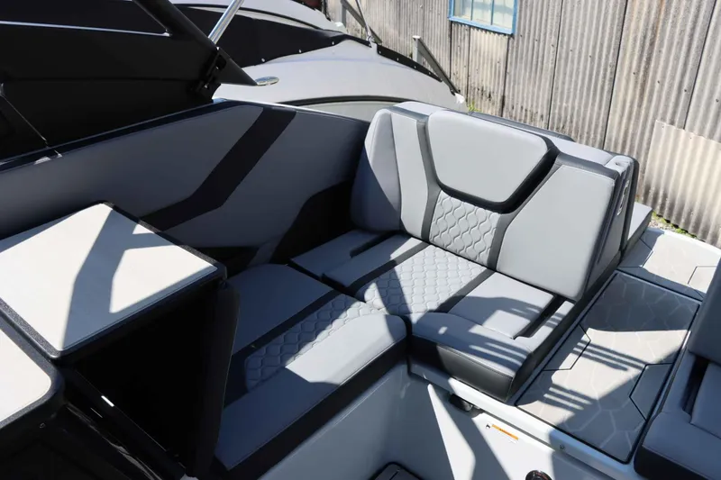 Slide: The Image of 2024 Yamaha Boats 255XE interior seating with modern gray upholstery design. - 28