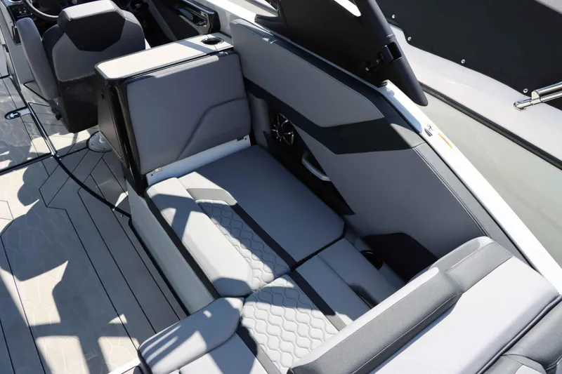 Slide: The Image of 2024 Yamaha Boats 255XE interior with sleek gray seating and modern design. - 31