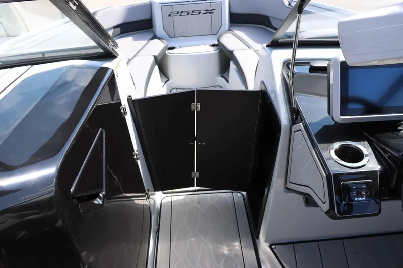 Slide: The Image of 2024 Yamaha Boats 255XE interior with sleek dashboard and seating area. - 34