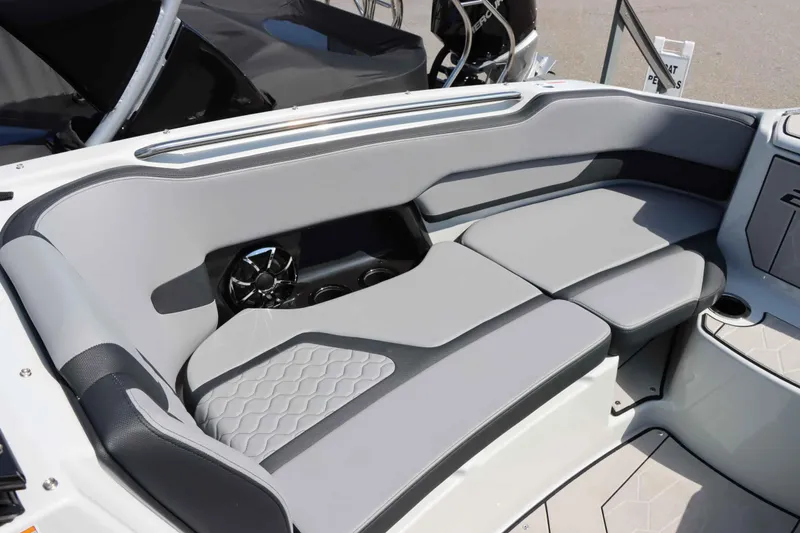 Slide: The Image of 2024 Yamaha Boats 255XE interior seating with sleek gray upholstery and modern design. - 36