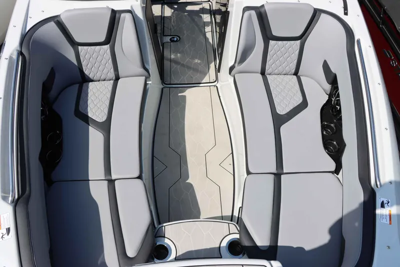 Slide: The Image of 2024 Yamaha Boats 255XE interior with gray seating and modern design. - 38