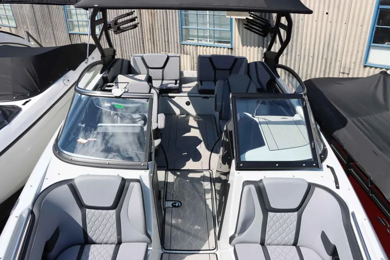Slide: The Image of 2024 Yamaha Boats 255XE interior, featuring sleek seating and modern design elements. - 39