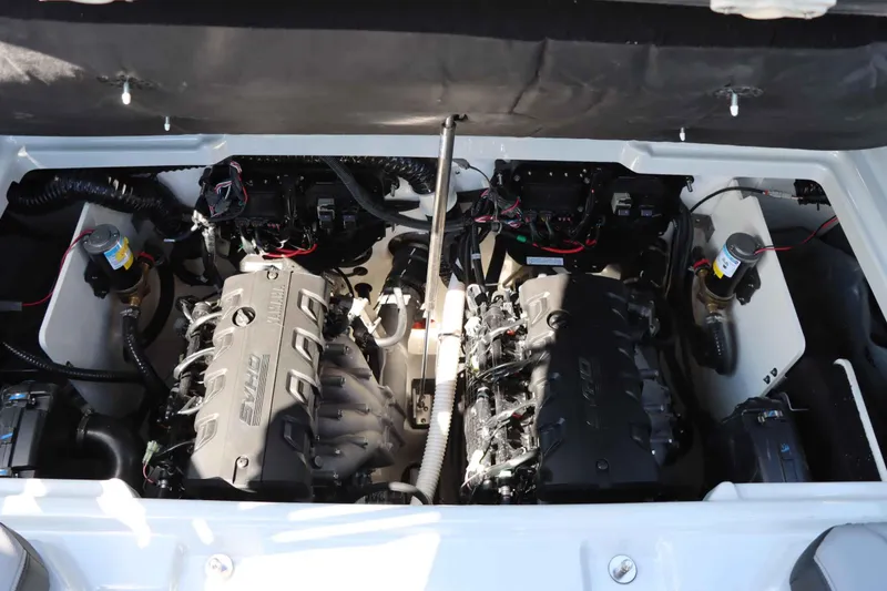 Slide: The Image of 2024 Yamaha Boats 255XE engine compartment with dual engines and wiring. - 40