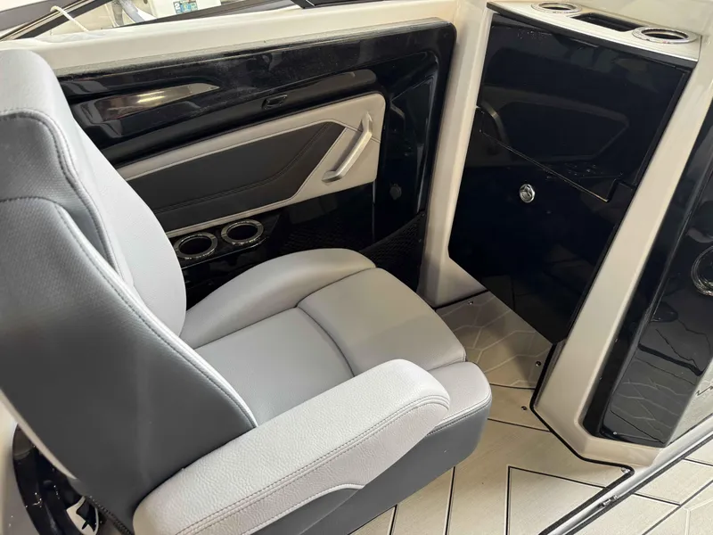 Slide: The Image of 2024 Yamaha Boats 255XE interior seating and console area. - 6