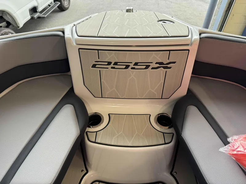 Slide: The Image of 2024 Yamaha Boats 255XE interior seating and storage area. - 8