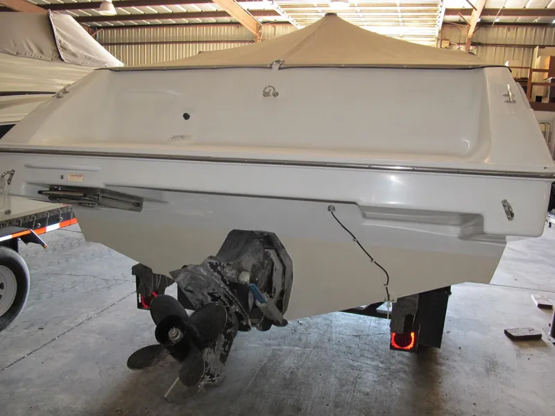 Slide: The Image of 1992 Chris-Craft 228 Concept Cuddy boat in storage, rear view. - 4