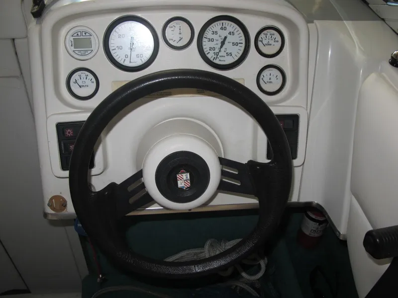 Slide: The Image of 1992 Chris-Craft 228 Concept Cuddy dashboard with steering wheel and gauges. - 7