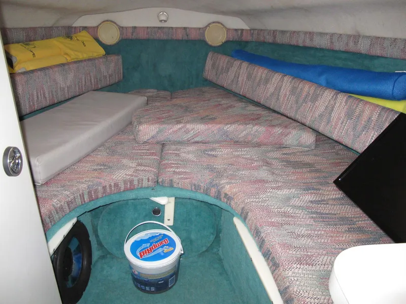 Slide: The Image of Interior cabin of a 1992 Chris-Craft 228 Concept Cuddy boat with seating and storage. - 8