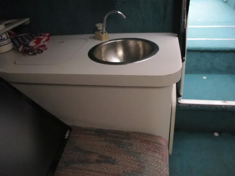 Slide: The Image of 1992 Chris-Craft 228 Concept Cuddy interior sink and countertop area. - 9