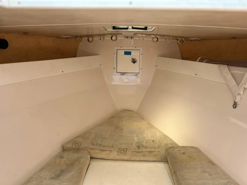 Slide: The Image of Interior cabin of 2003 Salt Shaker Custom Edition 30 boat with cushions and storage. - 13