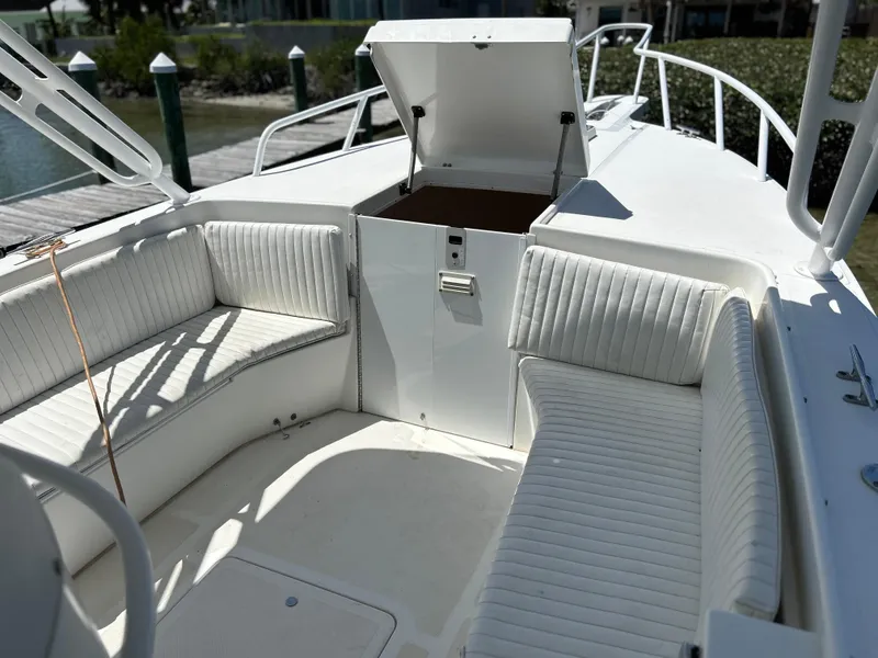Slide: The Image of Interior of a 2003 Salt Shaker Custom Edition 30 boat with white seating. - 15