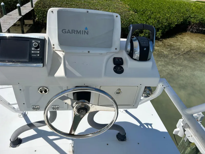 Slide: The Image of Control panel of a 2003 Salt Shaker Custom Edition 30 boat with Garmin navigation. - 16
