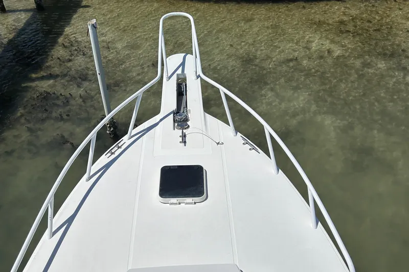 Slide: The Image of Bow of 2003 Salt Shaker Custom Edition 30 boat in shallow water. - 19