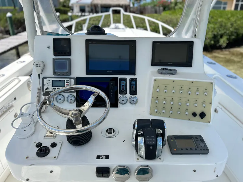 Slide: The Image of Control panel of a 2003 Salt Shaker Custom Edition 30 boat with navigation equipment. - 6