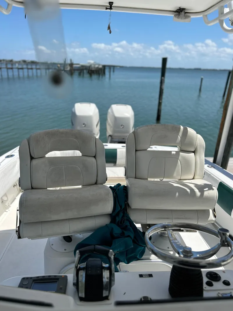 Slide: The Image of 2003 Salt Shaker Custom Edition 30 boat interior with dual seats and steering wheel. - 7