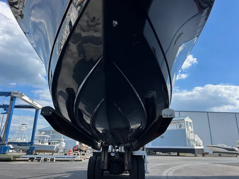 Slide: The Image of 2019 Tidewater 232 CC Adventure boat on a trailer, viewed from below. - 11