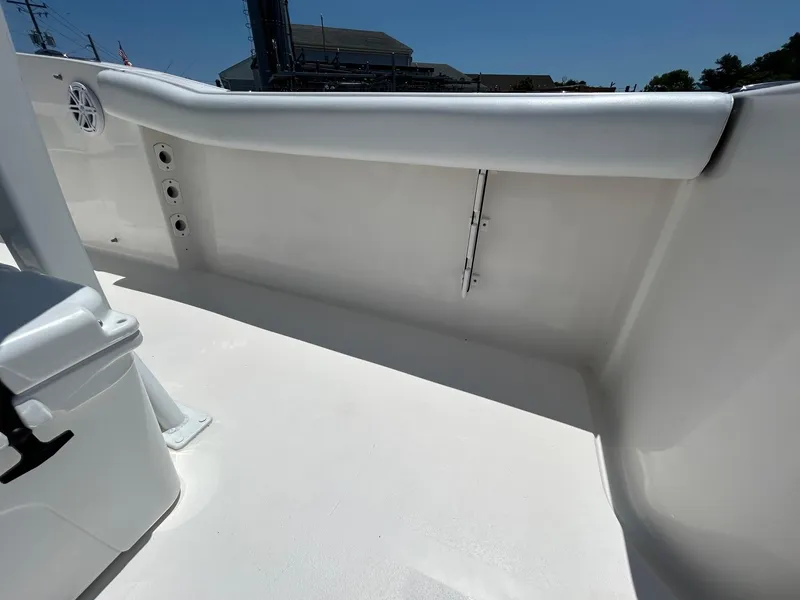 Slide: The Image of 2019 Tidewater 232 CC Adventure boat interior, white deck and padded side rail. - 14