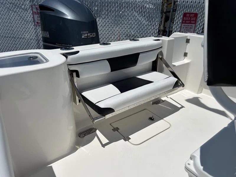 Slide: The Image of 2019 Tidewater 232 CC Adventure boat with Yamaha 250 outboard motor and foldable rear seat. - 18