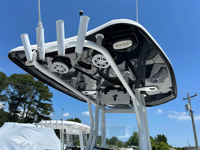 Slide: The Image of 2019 Tidewater 232 CC Adventure boat with T-top and rod holders. - 24