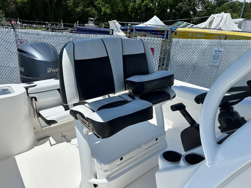 Slide: The Image of 2019 Tidewater 232 CC Adventure boat seating and console area. - 27