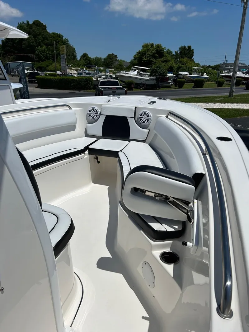 Slide: The Image of 2019 Tidewater 232 CC Adventure boat interior with seating and speakers. - 28