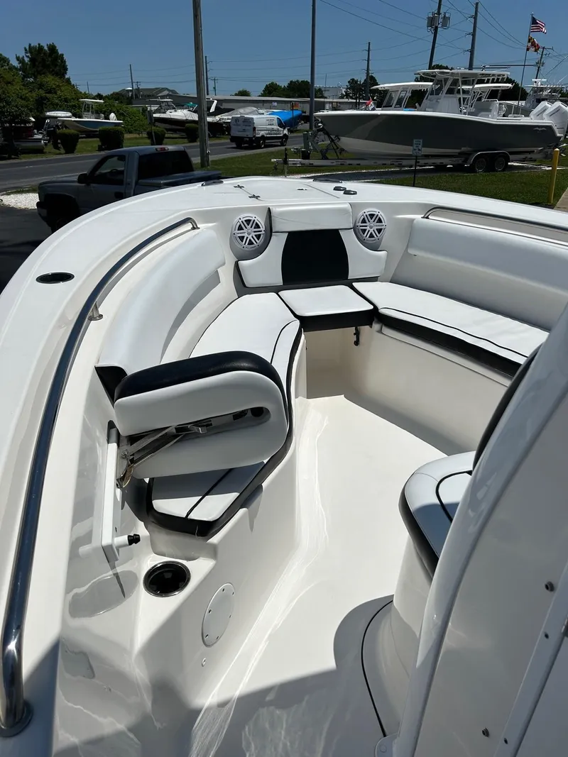 Slide: The Image of 2019 Tidewater 232 CC Adventure boat interior with seating and speakers. - 30