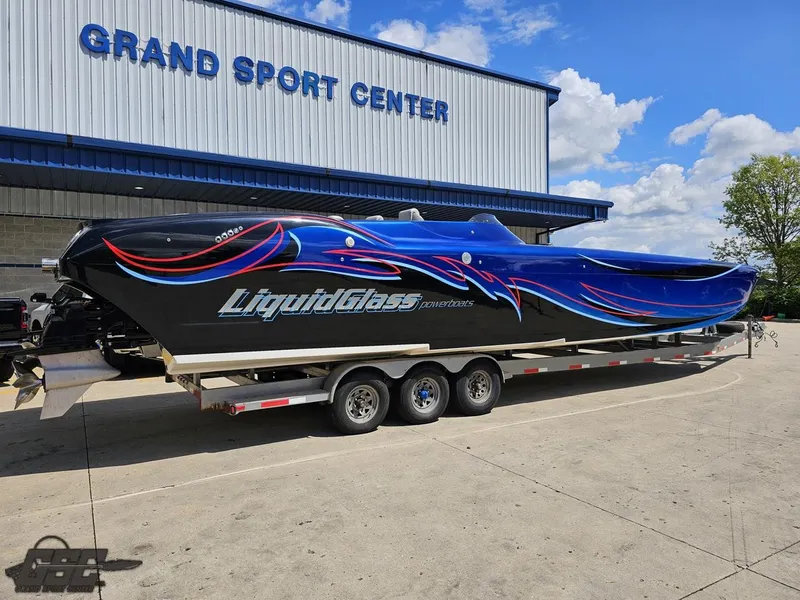 Slide: The Image of 2011 Catamaran Liquid Glass 41 boat on trailer at Grand Sport Center. - 11