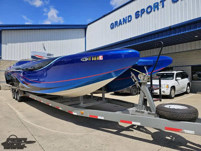 Slide: The Image of 2011 Catamaran Liquid Glass 41 on trailer outside Grand Sport Center. - 18