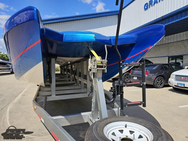 Slide: The Image of 2011 Catamaran Liquid Glass 41 on trailer, blue hull, parked outside. - 20