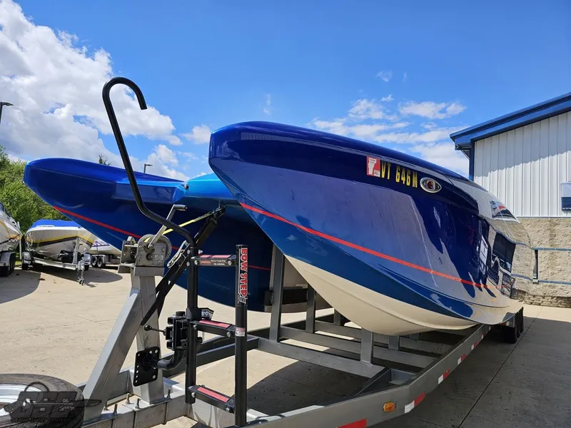 Slide: The Image of 2011 Catamaran Liquid Glass 41 on trailer, blue and white, outdoor storage. - 25