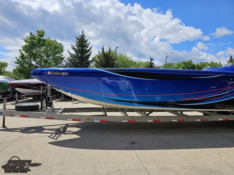 Slide: The Image of 2011 Catamaran Liquid Glass 41 boat on trailer under blue sky. - 28