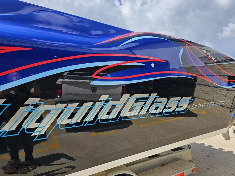 Slide: The Image of 2011 Catamaran Liquid Glass 41 with vibrant graphics on the hull. - 33