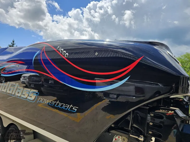 Slide: The Image of 2011 Catamaran Liquid Glass 41 powerboat with sleek design and vibrant graphics. - 42