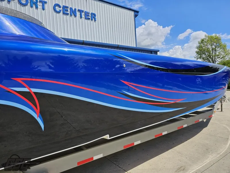 Slide: The Image of 2011 Catamaran Liquid Glass 41 with blue and black custom paint job. - 8