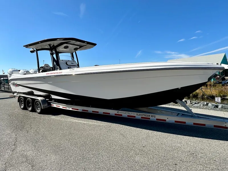 Slide: The Image of 2023 Glasstream 360 GSX Pro boat on a trailer under a clear blue sky. - 0