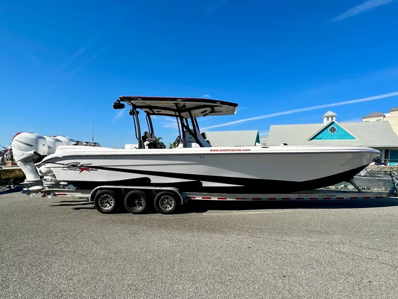Slide: The Image of 2023 Glasstream 360 GSX Pro boat on a trailer under a clear blue sky. - 1