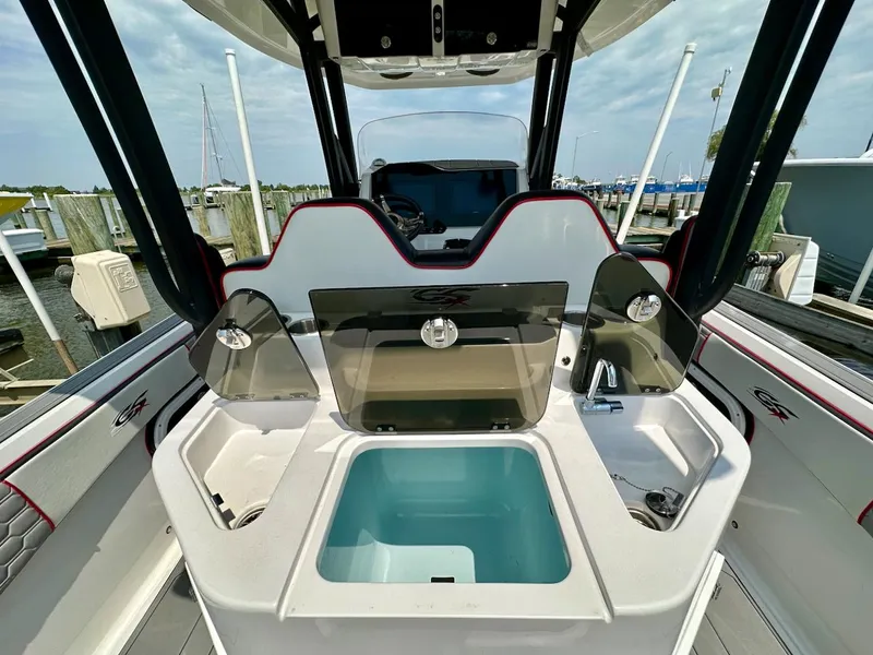 Slide: The Image of 2023 Glasstream 360 GSX Pro boat interior with center console and storage compartments. - 11