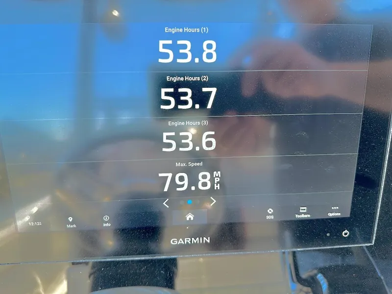 Slide: The Image of Garmin display showing engine hours and max speed on 2023 Glasstream 360 GSX Pro. - 18