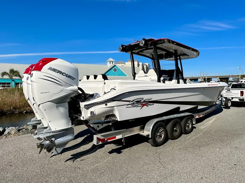 Slide: The Image of 2023 Glasstream 360 GSX Pro boat on a trailer with twin Mercury outboard engines. - 2