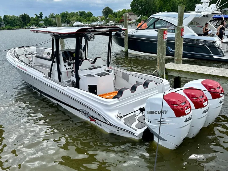 Slide: The Image of 2023 Glasstream 360 GSX Pro boat with triple Mercury 400 engines docked. - 4
