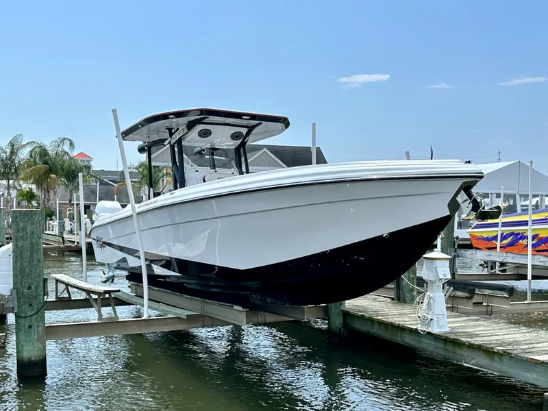 Slide: The Image of 2023 Glasstream 360 GSX Pro boat docked at a marina. - 5