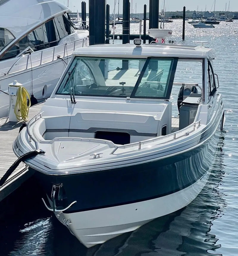 Slide: The Image of 2023 Formula 380 Super Sport Crossover OB docked at a marina. - 3