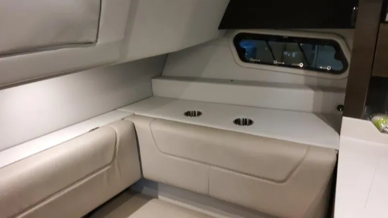 Slide: The Image of 2023 Formula 380 Super Sport Crossover OB cabin interior with seating and window. - 39