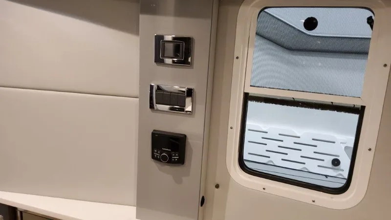 Slide: The Image of Interior controls and window of 2023 Formula 380 Super Sport Crossover OB boat. - 42