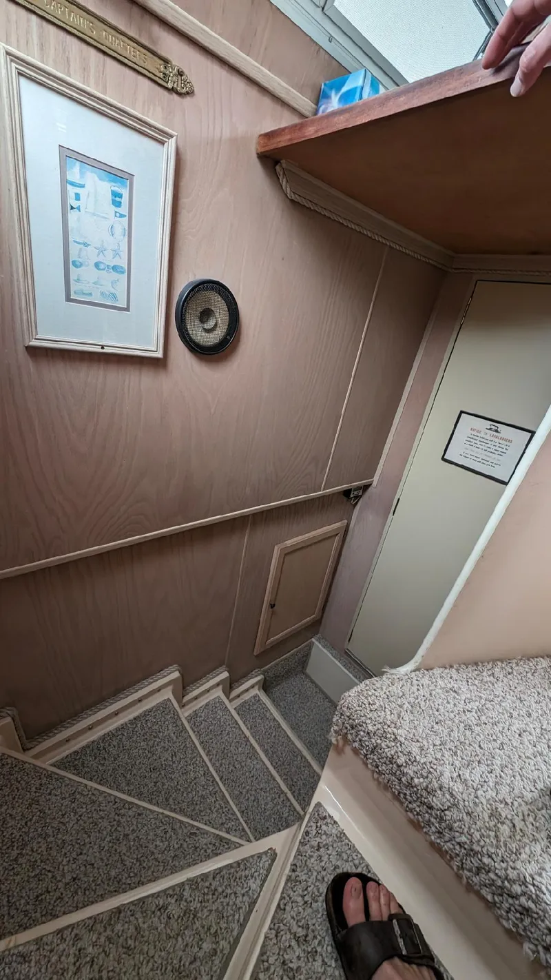 Slide: The Image of Staircase inside 1992 Holiday Mansion houseboat with framed picture and wall clock. - 37