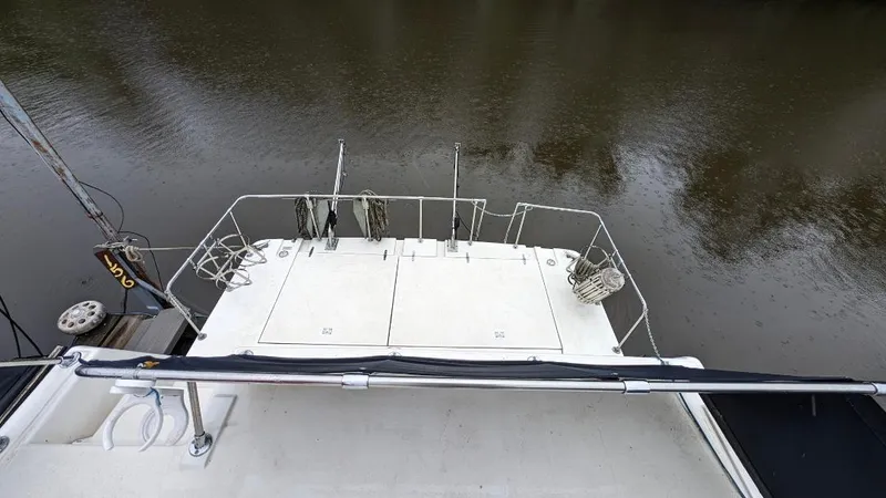 Slide: The Image of 1992 Holiday Mansion houseboat deck overlooking calm water. - 38