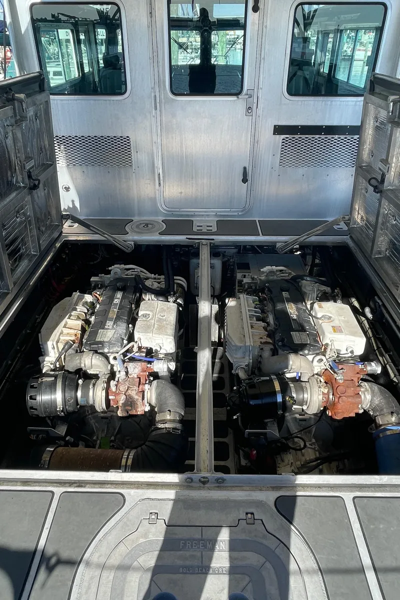 Slide: The Image of Engine compartment of a 2006 SAFE Boats 42 FC, showcasing dual engines. - 3