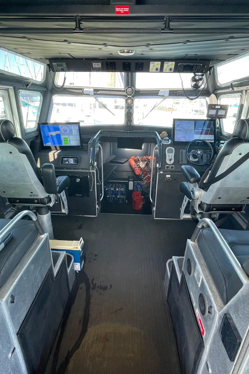 Slide: The Image of Interior of 2006 SAFE Boats 42 FC, featuring navigation equipment and seating. - 4
