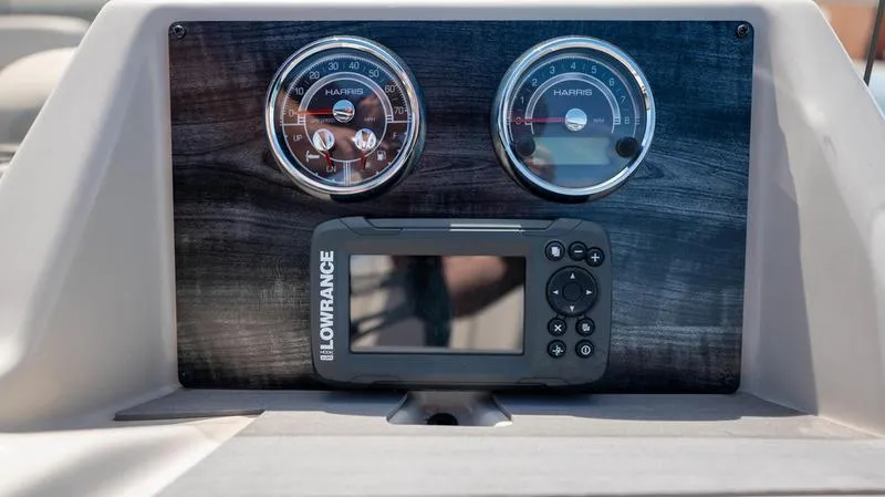 Slide: The Image of Dashboard of 2022 Harris CRUISER 230 SLDH with gauges and Lowrance display. - 12